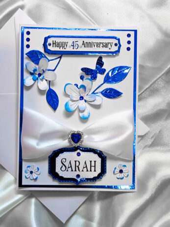 Front-on photograph of a handmade card with the custom top message: 'Happy 45th Anniversary