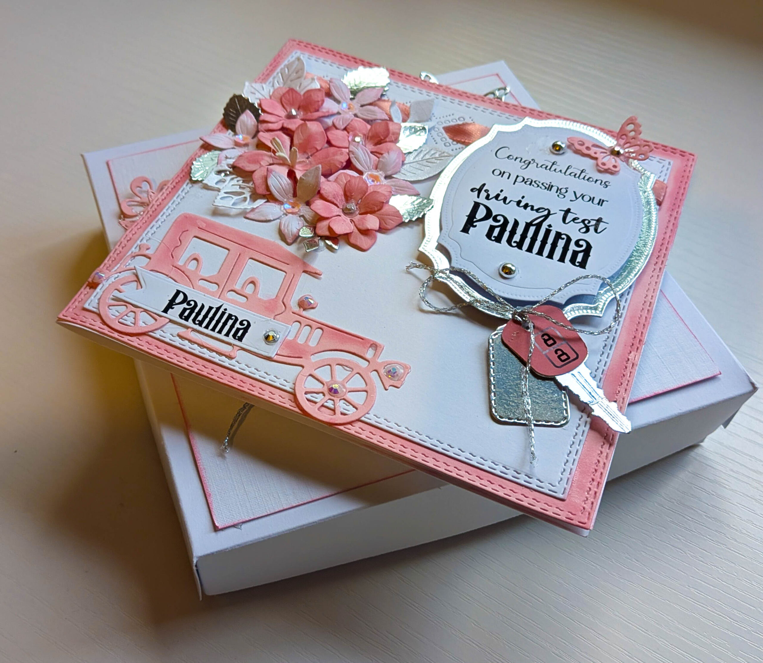 Handmade personalised pink luxury boxed driving test congratulations card shown with decorated matching presentation gift box.