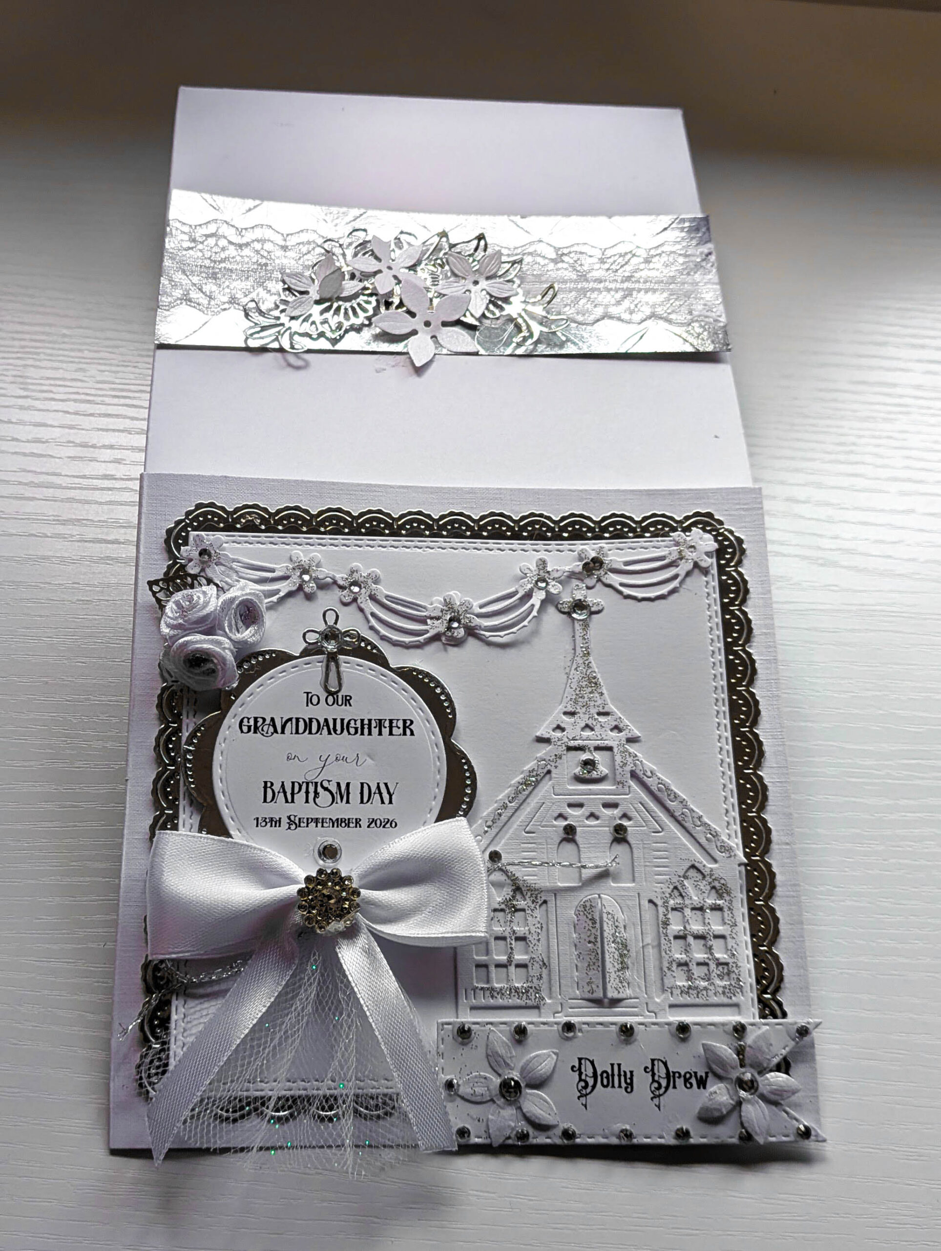 Handcrafted 15cm white and silver christening card with personalised name banner Dolly Drew and rhinestone accents.